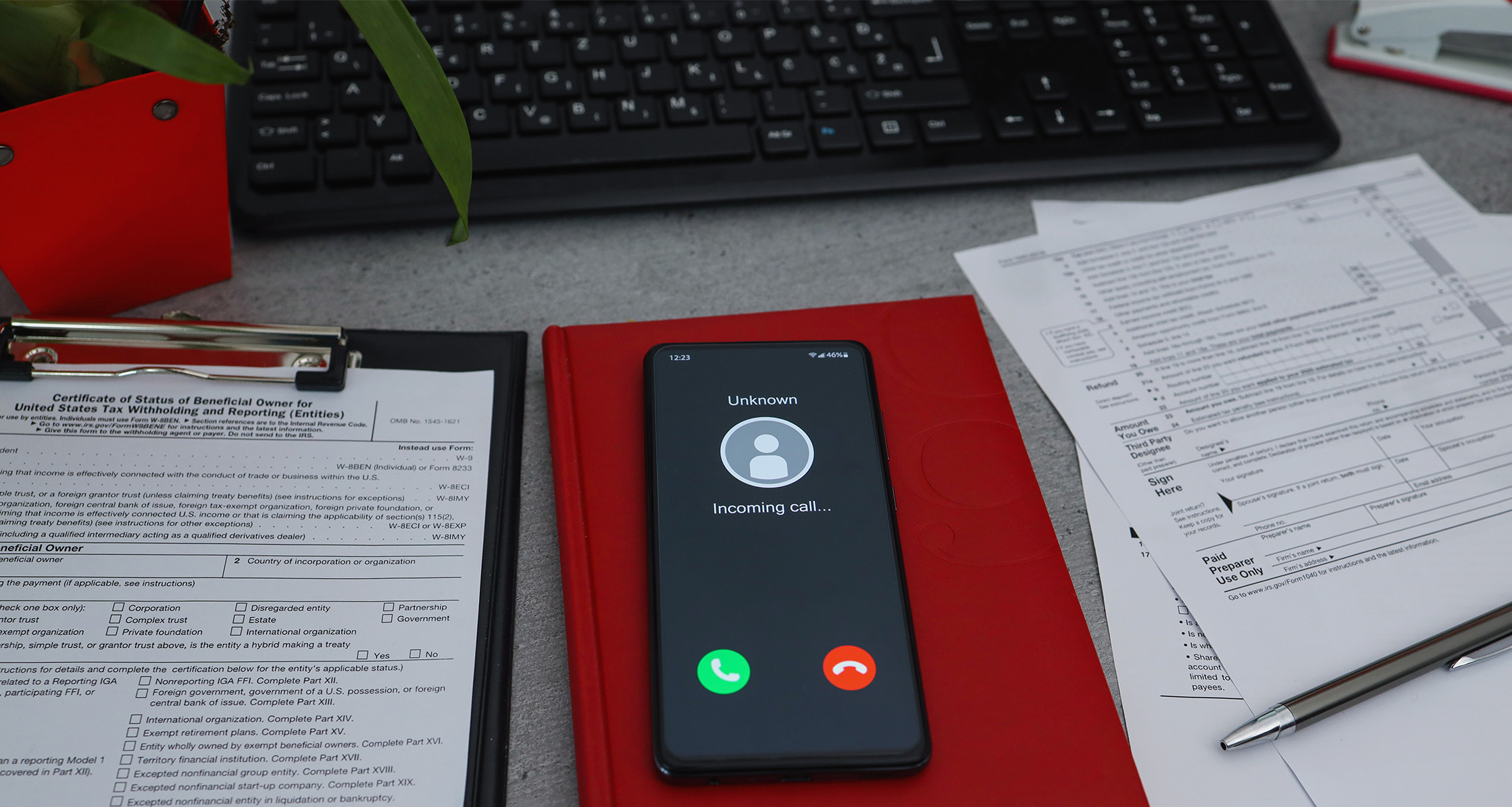 Unknown caller on phone depicting tax scam solicitation.