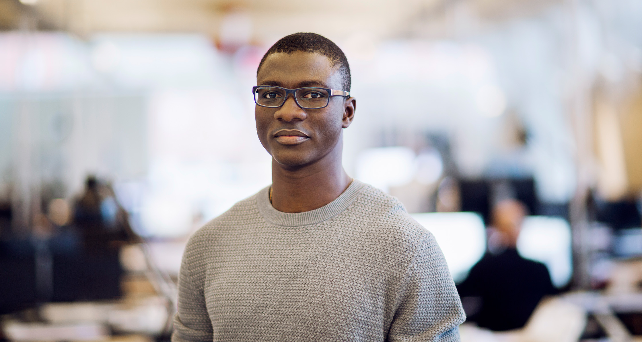 Man in office looking directly at camera.
