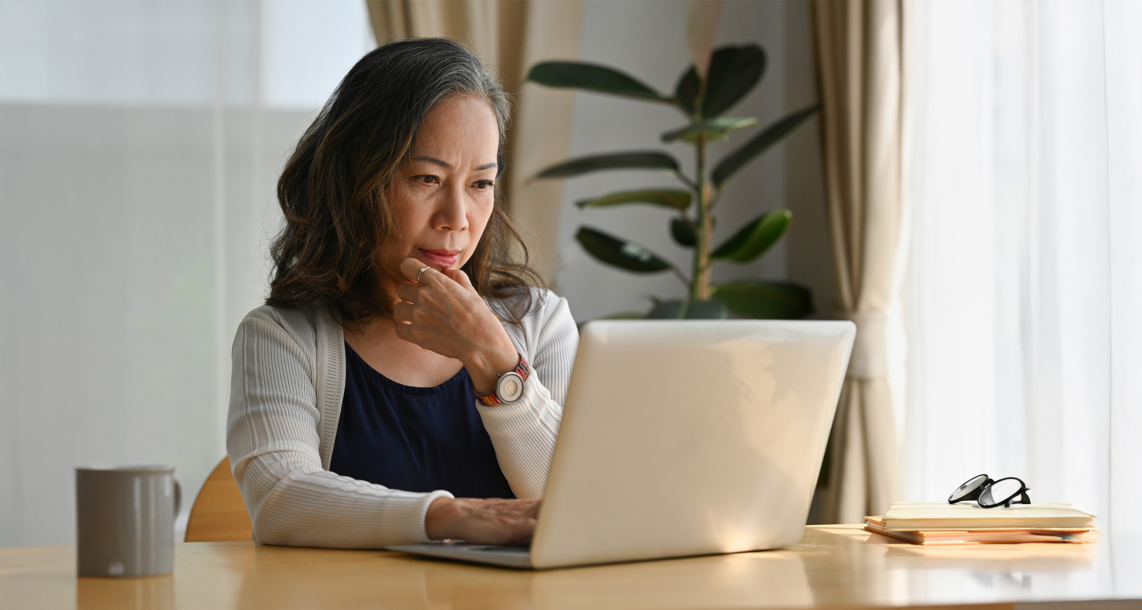 Woman on laptop computer at home.