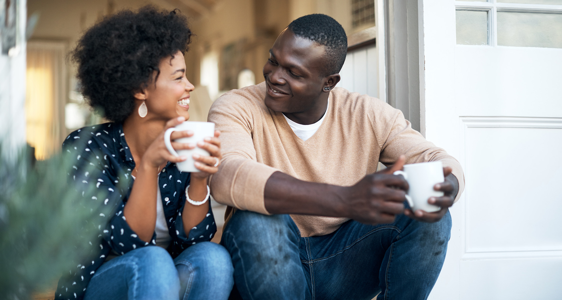 couple talking on front porch