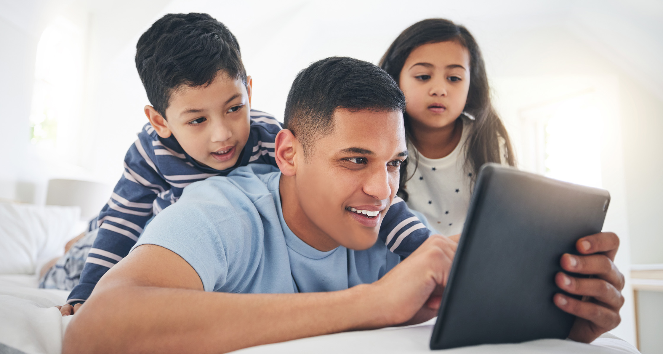 Family using a digital tablet.