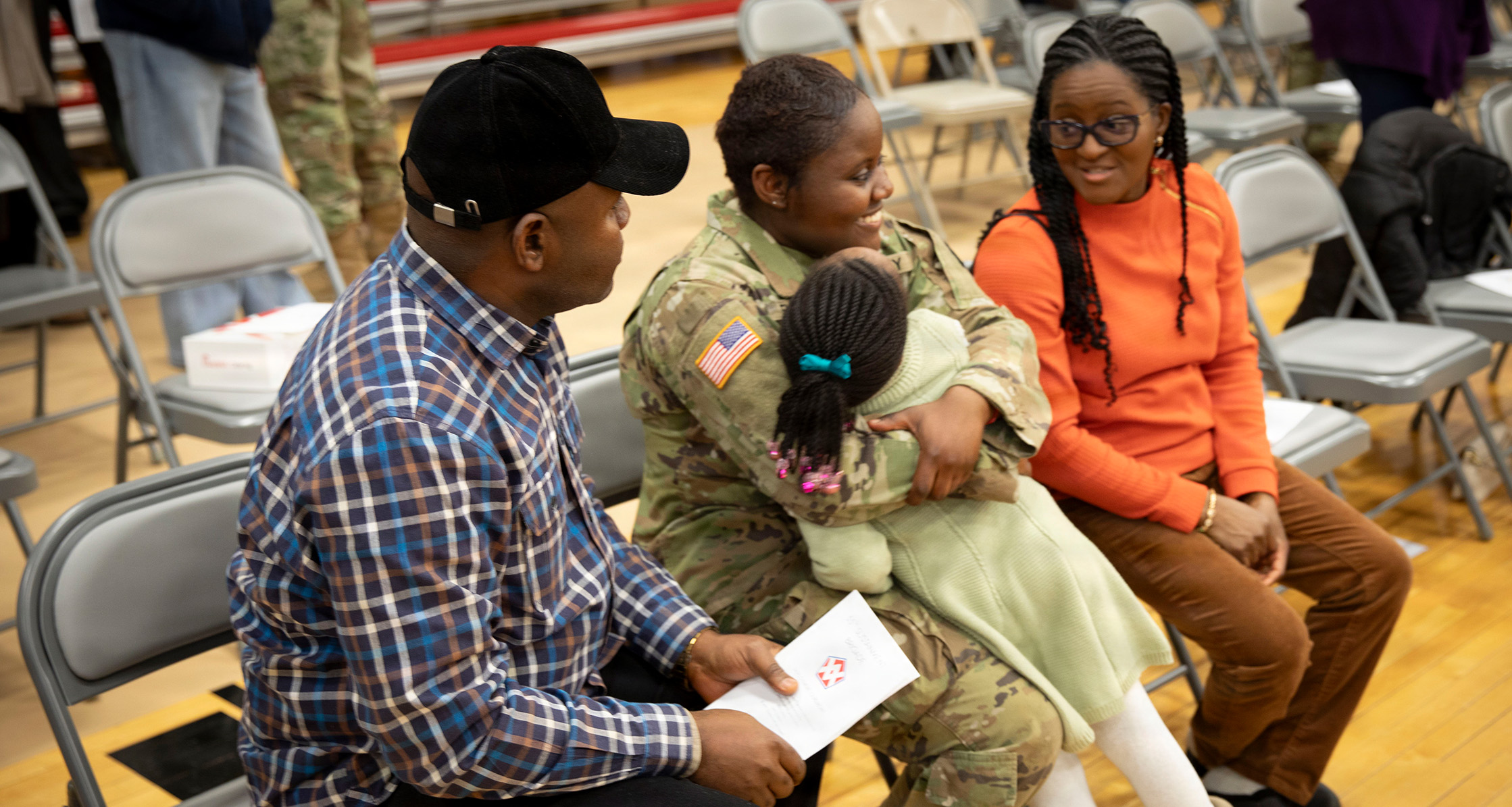 Families gather to say goodbye during a deployment ceremony.