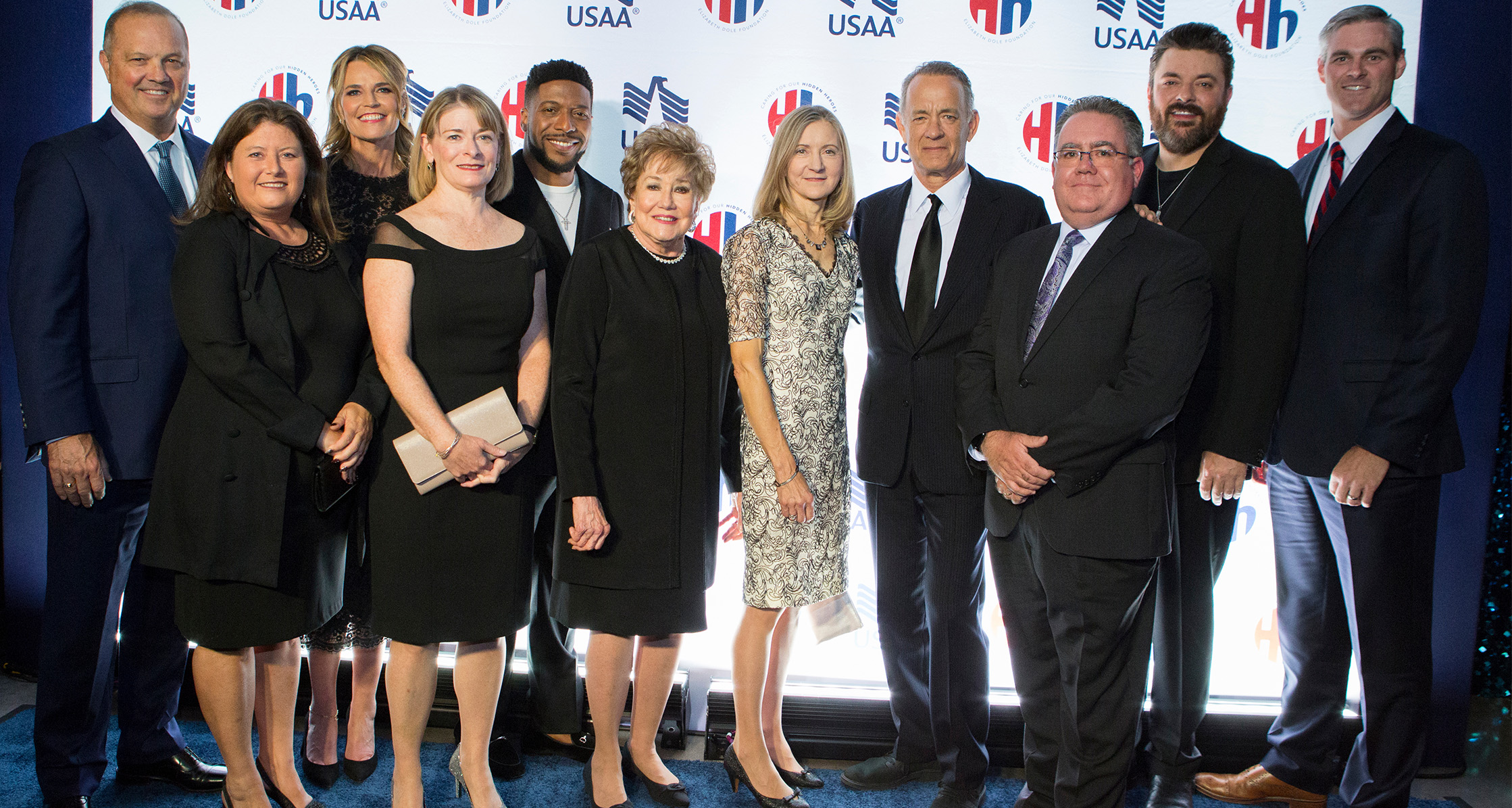 Tom Hanks at Heroes & History Makers program with Elizabeth Doyle and other attendees.