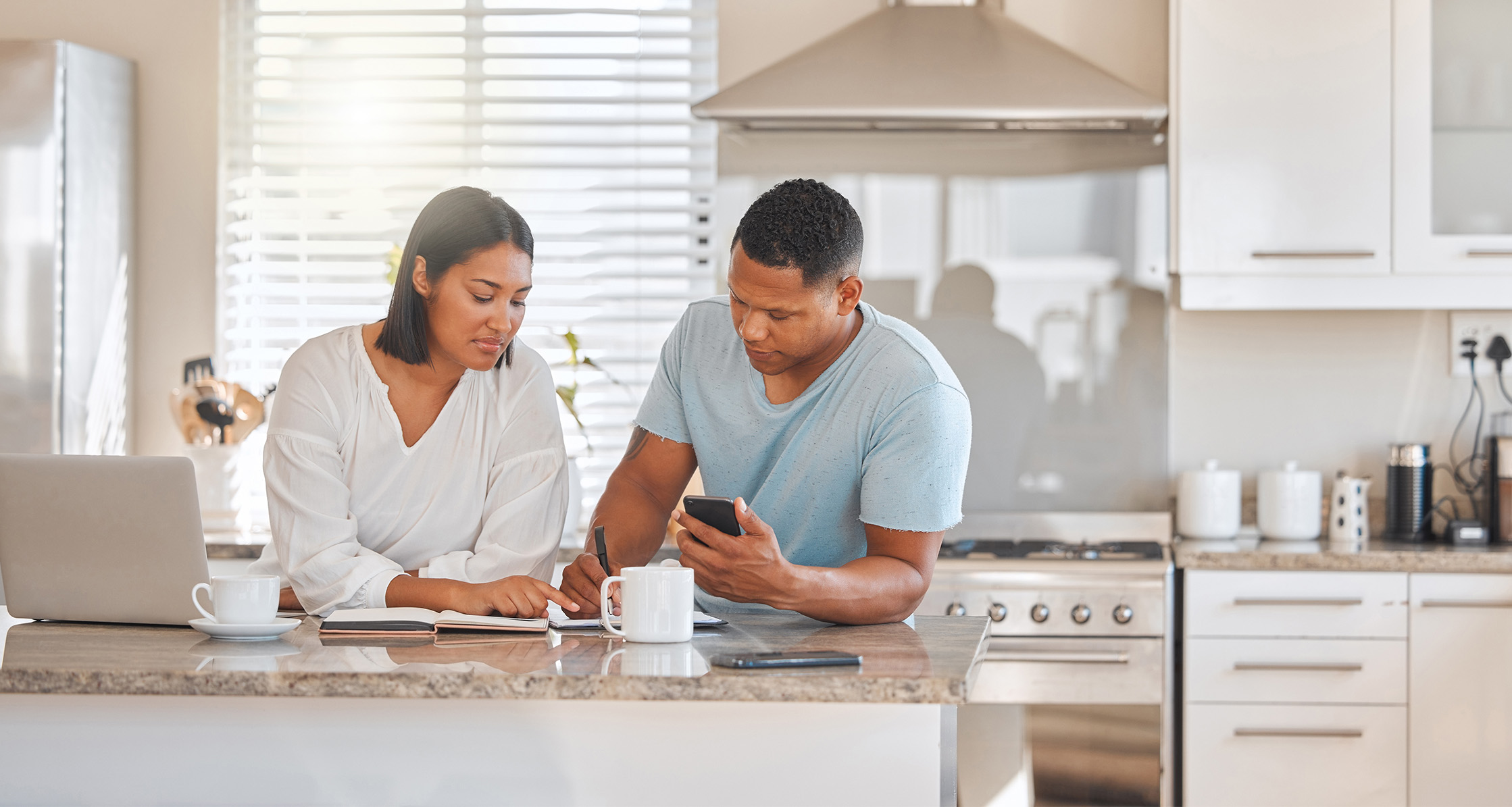 Military couple reviewing medical records list before moving.