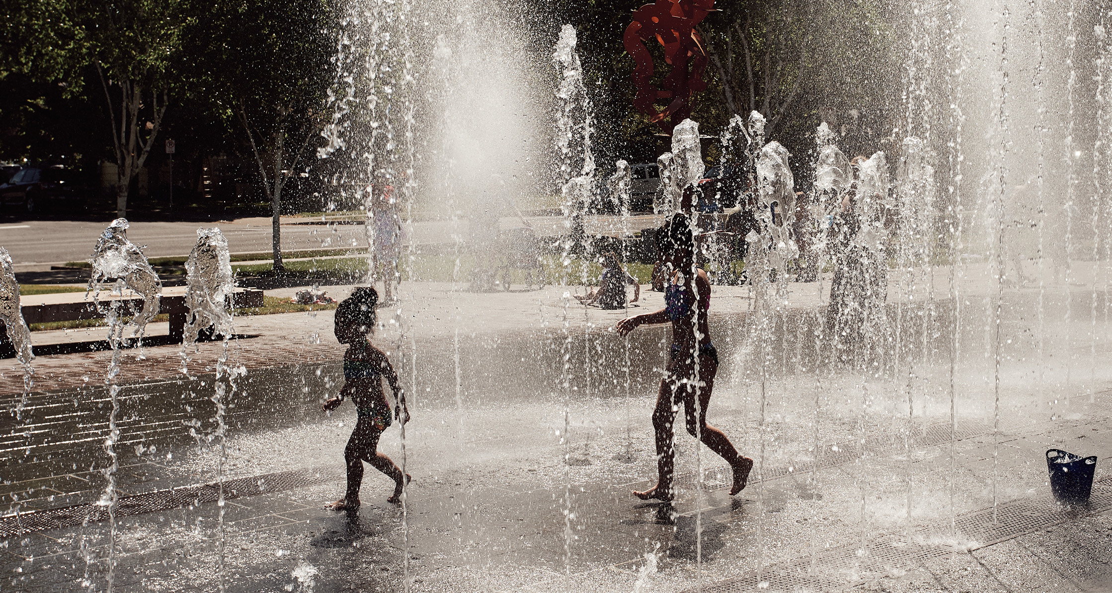 Children playing on neighborhood splash pad.