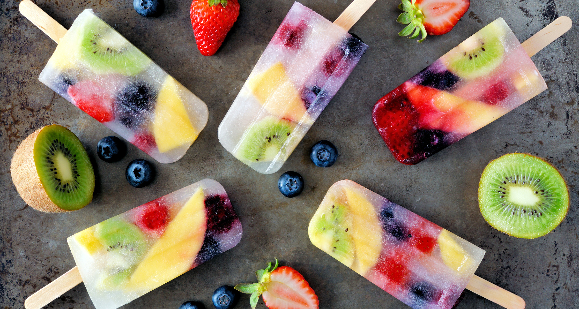 Healthy mixed fruit summer popsicles.
