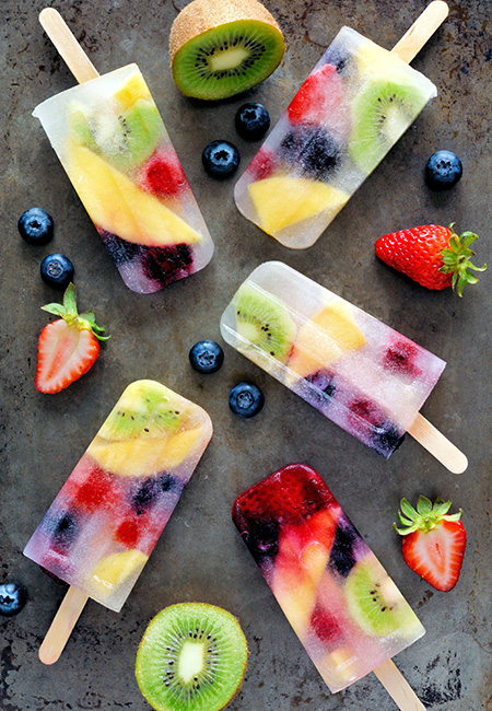Healthy mixed fruit summer popsicles.
