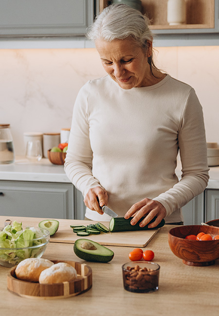 Person preparing a healthy salad.