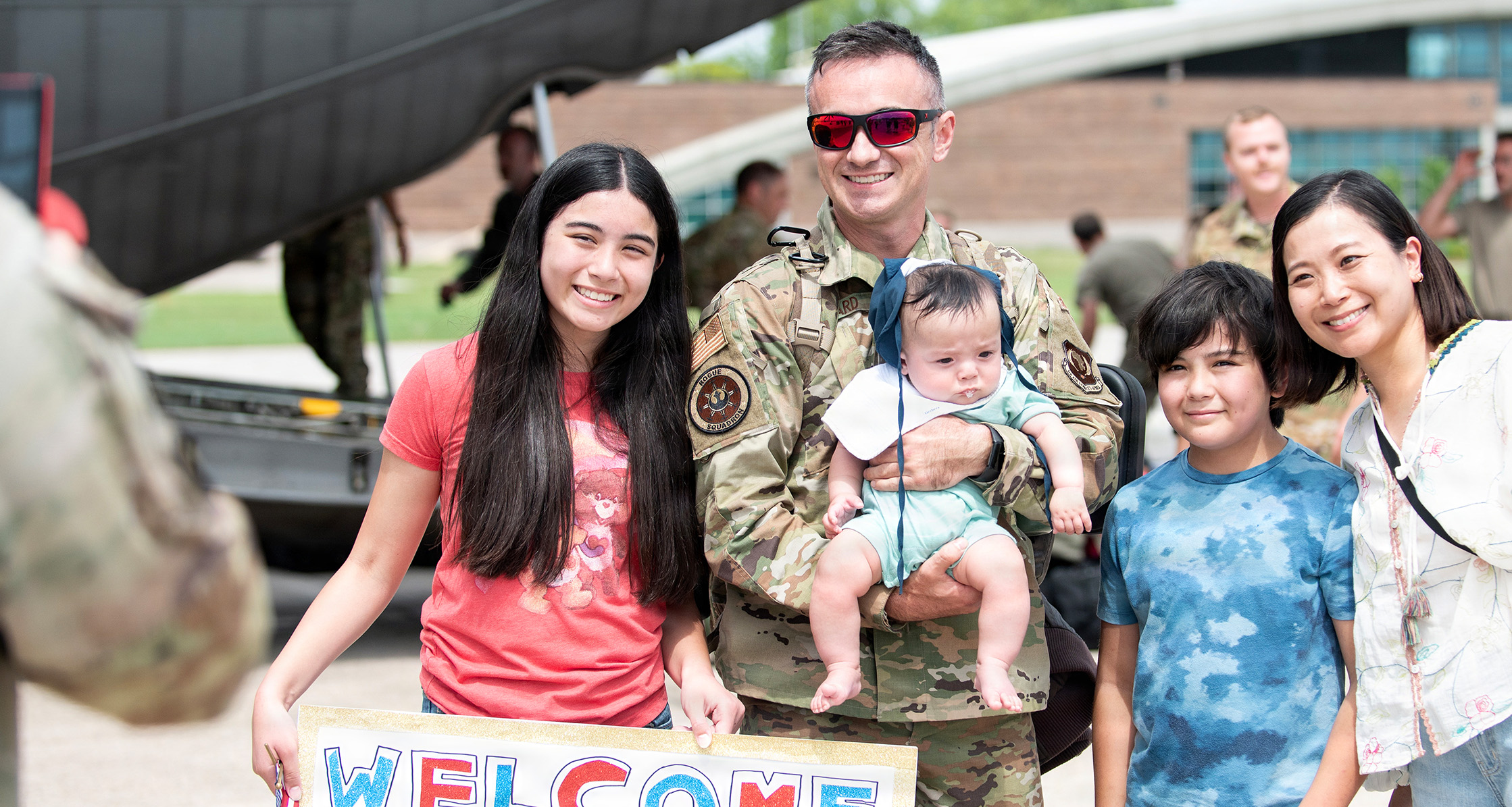 Service member is welcomed home by family.